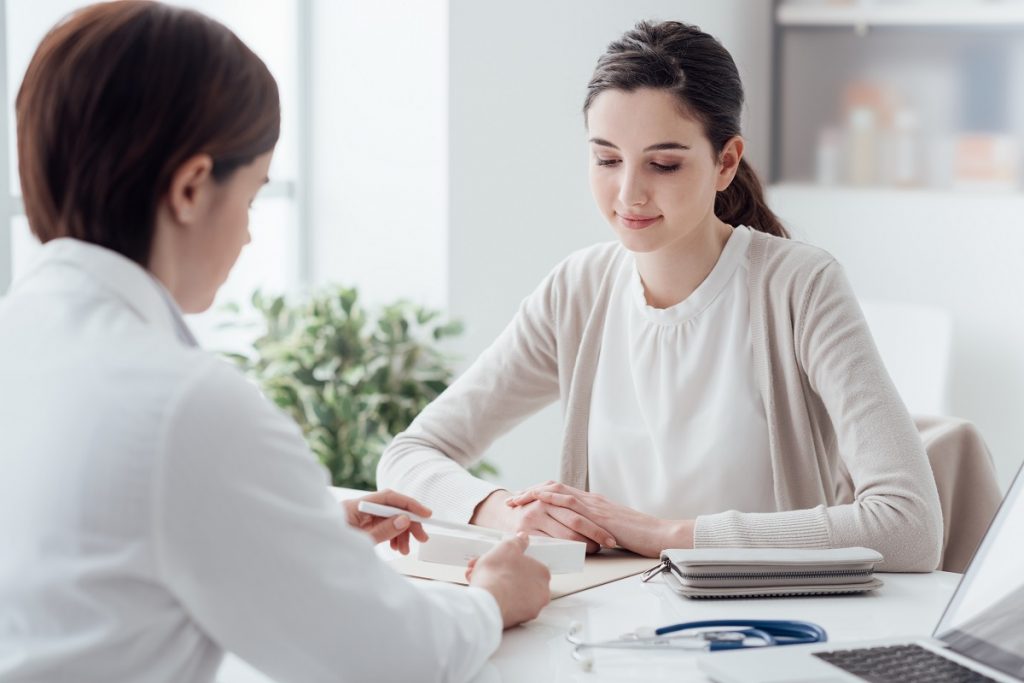 Woman consulting an ob-gyn