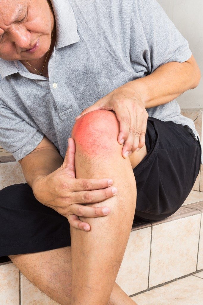 old person with hurt knee