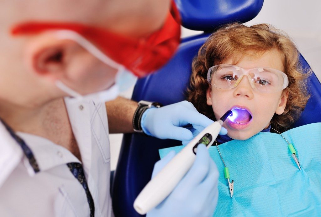 kid having teeth cleaned