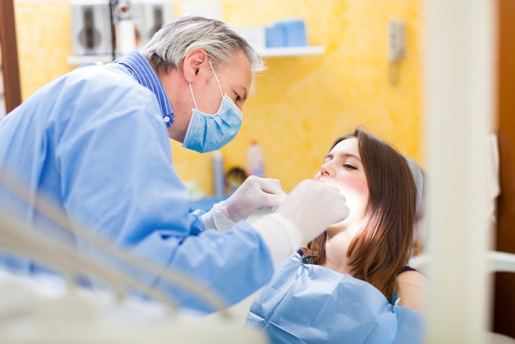 dentist attending to a woman