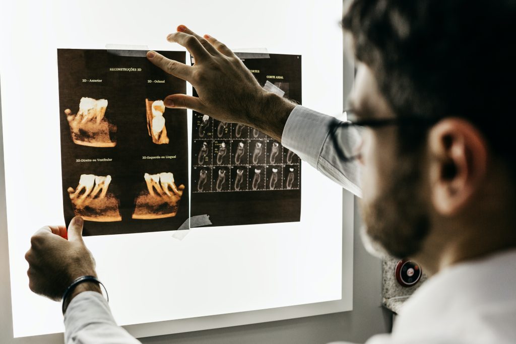 Dentist looking at xray